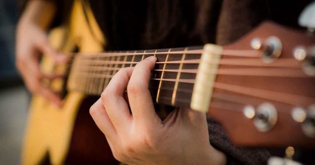 playing acoustic guitar