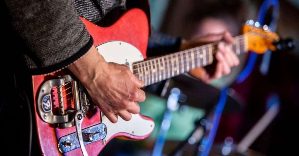 playing electric guitar