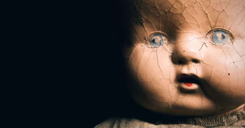 cracked paint on antique doll