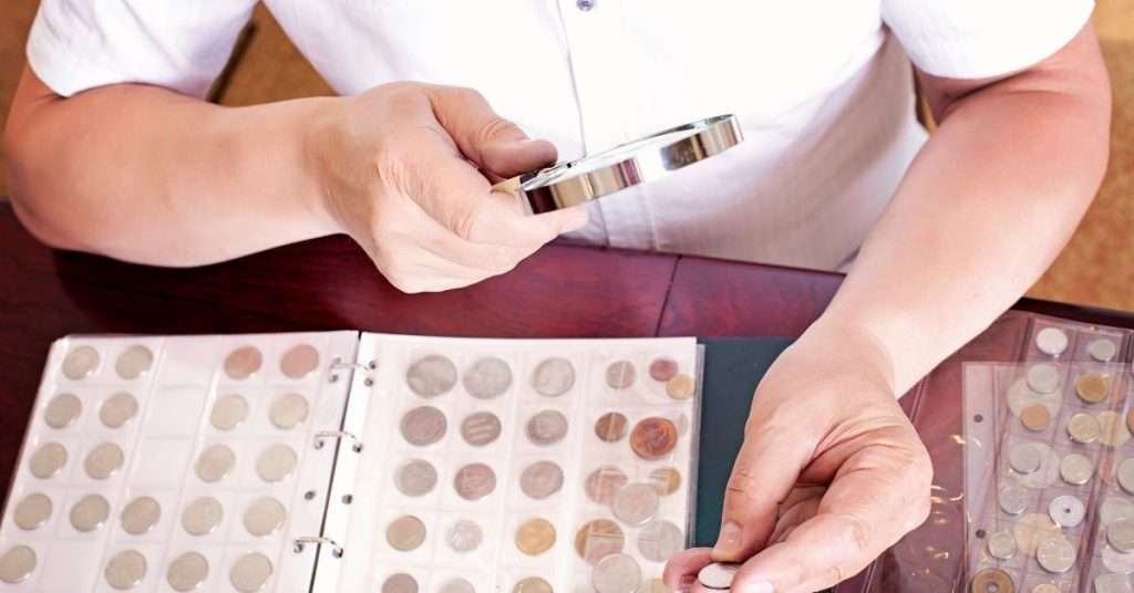 magnifying glass with coin collection