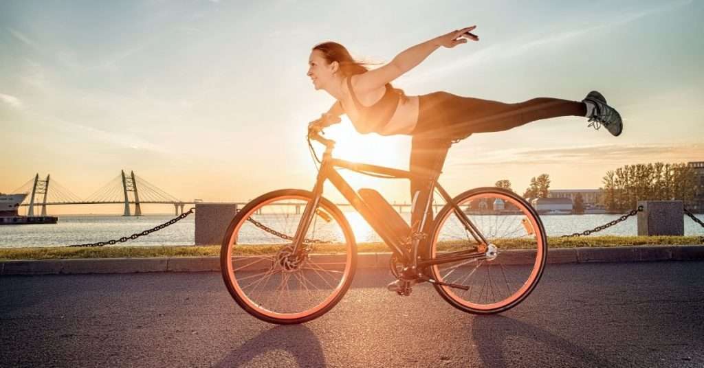 woman doing bike tricks